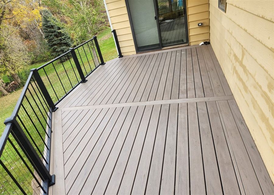 Composite deck with a sunken fire pit at sunset