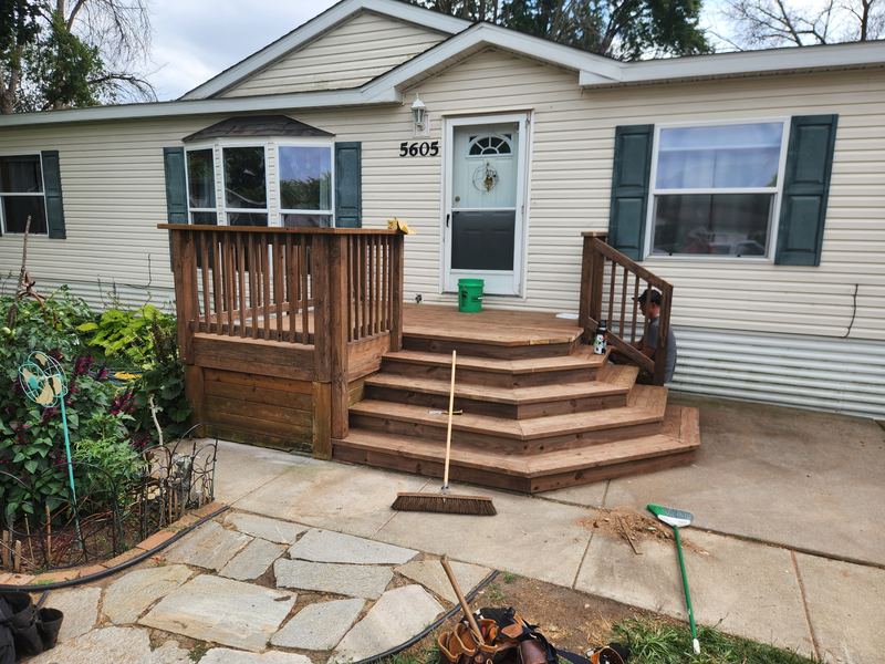 Wraparound cedar steps on a front entry deck