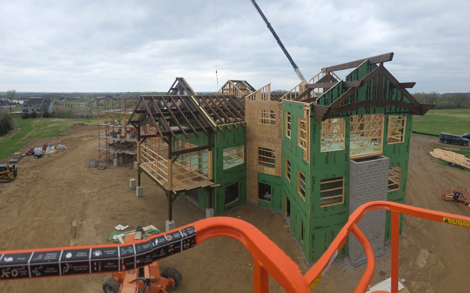 Custom timber frame home going up, seen from the lift