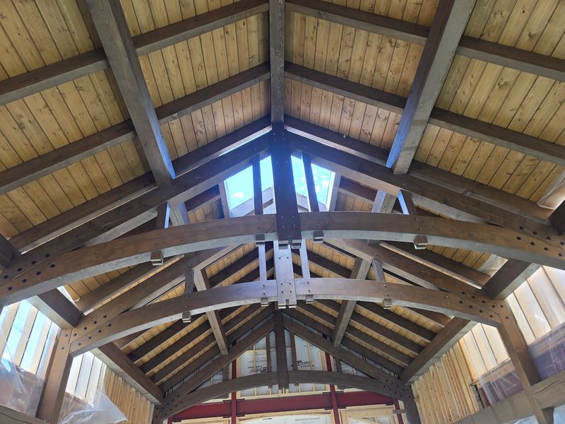 Timber frame ceiling with arched trusses